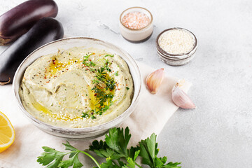 Baba ghanoush, babaganoush or eggplant hummus on the bowl with bread
