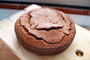 Pastries, home made banana cake ready for eat on a wooden background.