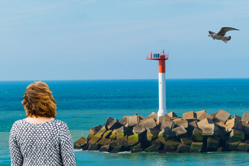 Woman and Seagull at Lighthouse 