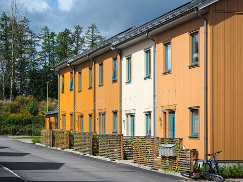 Street with Scandinavian style townhouses or condominium apartments 