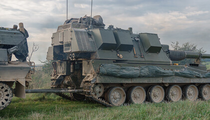 British Army Challenger Armored Repair and Recovery Vehicle (CRARRV) towing an AS-90 Gun Equipment 155mm L131 on military training exercise, Wilts UK