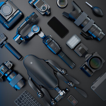 Top view of designer workspace and photography gear on black table background