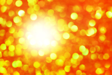 Defocus light orange and green glitter. Abstract bokeh light background.