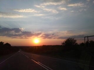 sunset over the road