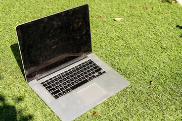 Laptop on the garden, close-up.