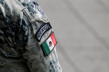 The Mexican flag is seen on the uniform of an army soldier during a parade celebrating the Mexico's...