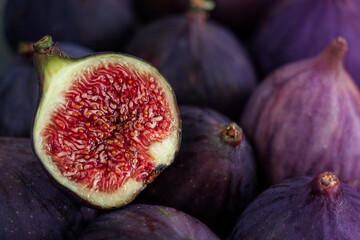 Сlose-up of a fig cut in half lying on a ripe fig