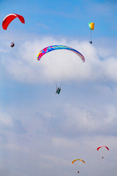 Five Paragliders In Air