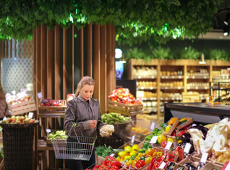 Woman buying vegetables at the market
