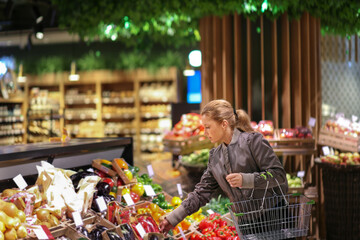 Woman buying vegetables at the market