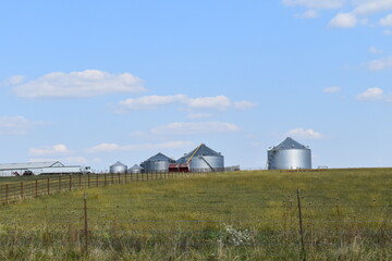 Fototapeta na wymiar Grain Bins in a Field