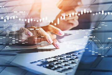Businesswoman wearing white shirt is typing message on laptop
