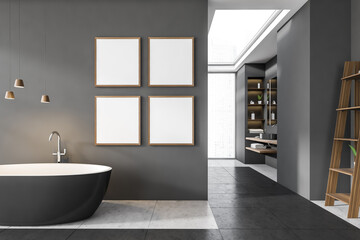 Fototapeta na wymiar Dark bathroom interior with bathtub, four empty white posters