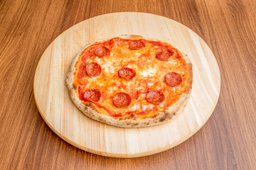 Small Italian pizza with melted mozzarella cheese and spicy pepperoni slices