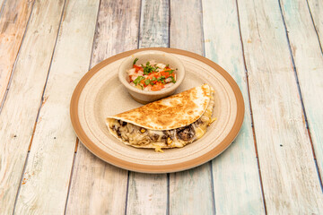 Mexican huitlacoche quesadilla with corn mushroom and melted strong cheese and pico de gallo