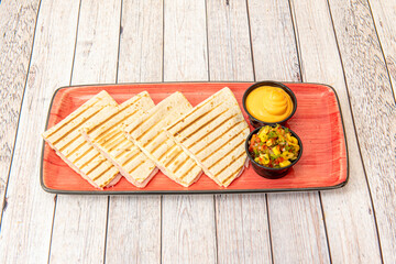 Quesadillas synchronized with melted cheese and ham with cream cheddar cheese, sweet corn and pico...
