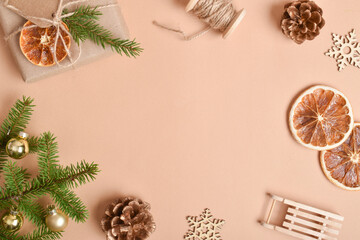 The template is a frame on a beige background with various natural decorations for Christmas.