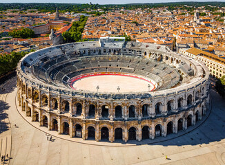 The aerial view of Arena of Nîmes, an old Roman city in the Occitanie region of southern France - obrazy, fototapety, plakaty