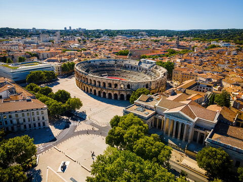 The aerial view of Arena of Nîmes, an old Roman city in the Occitanie region of southern France