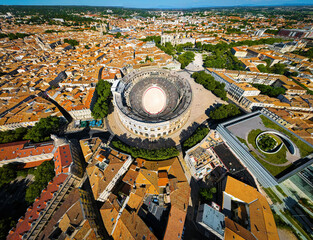 The aerial view of Arena of Nîmes, an old Roman city in the Occitanie region of southern France