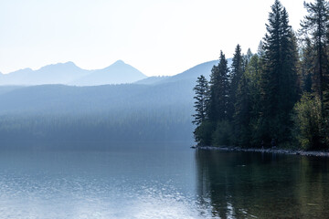 Very hazy and smokey view of Bowman Lake, in the North Fork area of Glacier National Park Montana. Smoke is from nearby wildfires