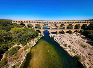Papier Peint photo autocollant Pont du Gard The aerial view of the Pont du Gard, an ancient tri-level Roman aqueduct bridge in France