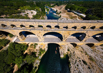 The aerial view of the Pont du Gard, an ancient tri-level Roman aqueduct bridge in France
