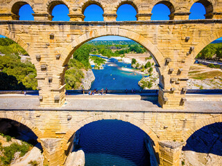 The aerial view of the Pont du Gard, an ancient tri-level Roman aqueduct bridge in France