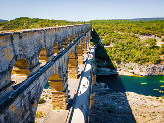 The aerial view of the Pont du Gard, an ancient tri-level Roman aqueduct bridge in France - obrazy, fototapety, plakaty