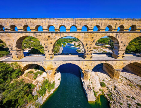 The aerial view of the Pont du Gard, an ancient tri-level Roman aqueduct bridge in France