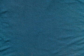 texture of crumpled greenish fabric.