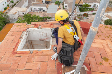 Mobile phone worker installing antennas