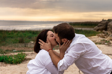 couple in love kissing on the seashore