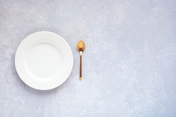 Dessert plate with a golden spoon