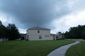 Fototapeta na wymiar Thunderstorm cloud above a Florida community