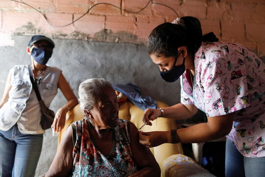 Venezuelan healthcare workers go from door to door to vaccinate residents against the coronavirus disease (COVID-19)