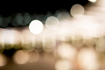 Fototapeta premium Gold or yellow bokeh texture background with glowing and illuminated, holiday and festive for celebration, New Year or Merry Christmas, no people, blur and defocused with graphic or effect.