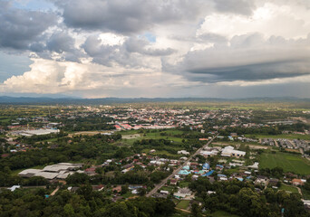 Fototapeta na wymiar Aerial view of Nan downtown view from drone. Nan Province is a charming destination in northern Thailand with a fascinating landscape, history and culture.