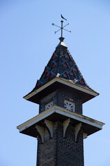 Fototapeta premium Urban garden tower on isolated blue sky background