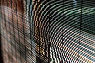 Brown straw blinds close up. Low DOF. Selective focus.