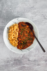 vegan eggplant lentil curry with brown rice, healthy plant-based food