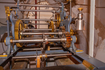 handcrafted antique bell tower clock mechanism from the 19th century that moves 4 clocks, one for each face
