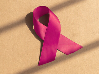 Pink medical ribbon as symbol of women health. Breast cancer concept.