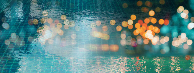 blur light of bar or pub reflection on blue water swimming pool summer party at night banner background - obrazy, fototapety, plakaty