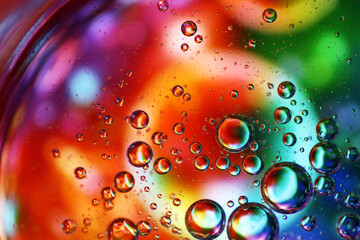 Oil bubbles on top layer of water