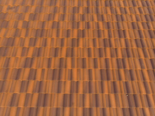 Obraz na płótnie Canvas Orange brown new house roof texture in rural village