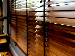 white window shutter blind with light from sun home interior concept