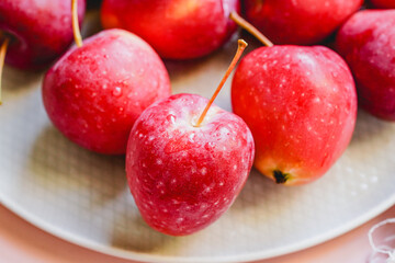 Indoor red small apple cut, beautiful fresh juicy fruit