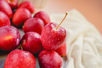 Indoor red small apple cut, beautiful fresh juicy fruit