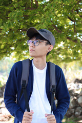 Portrait of asian menswear wearing hat and glasses